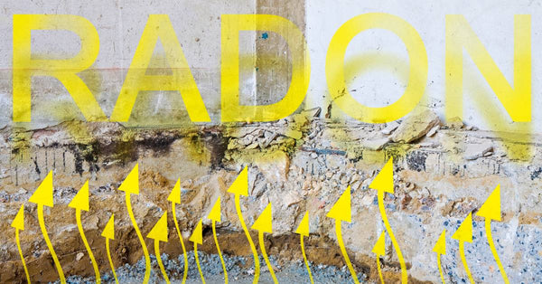 The crumbling basement wall of a home features yellow arrows pointing to the word "radon" to demonstrate radon gas.