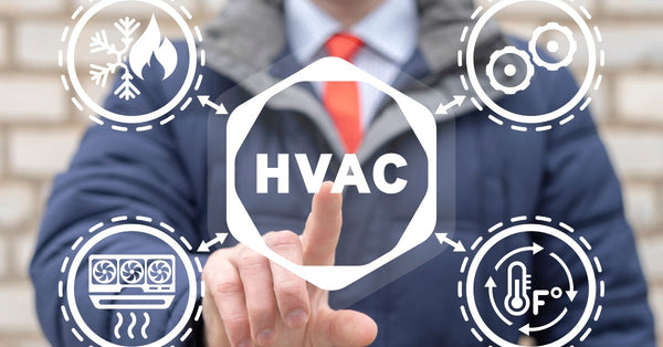 A man using a virtual touchscreen presses his pointer finger on "HVAC." Four heating and cooling symbols surround it.