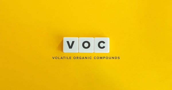 Three letter blocks come together on a yellow background to spell VOC. Underneath it reads "volatile organic compounds."